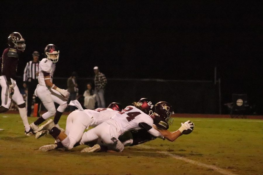 Senior Trent Howell powers through defensive line to score a touchdown. 