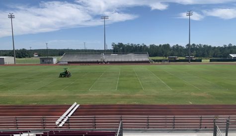 Coach James Ray spends many hours maintaining the football field. 