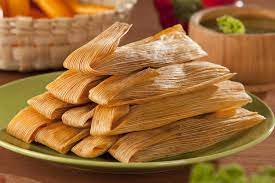 A common food shared at Christmas dinner is tamales. 