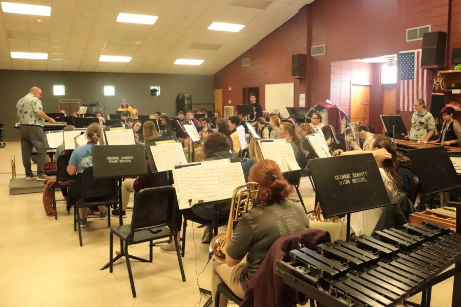 The concert band rehearses to perfect music. 