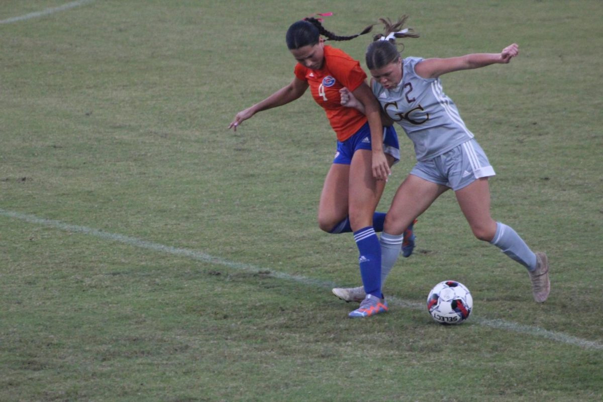 Presley Howell prepping to kick the ball at Gulfport game. 