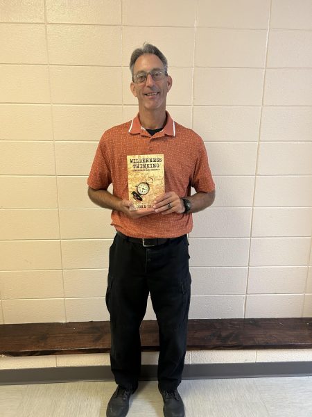 John Glass holding his book.