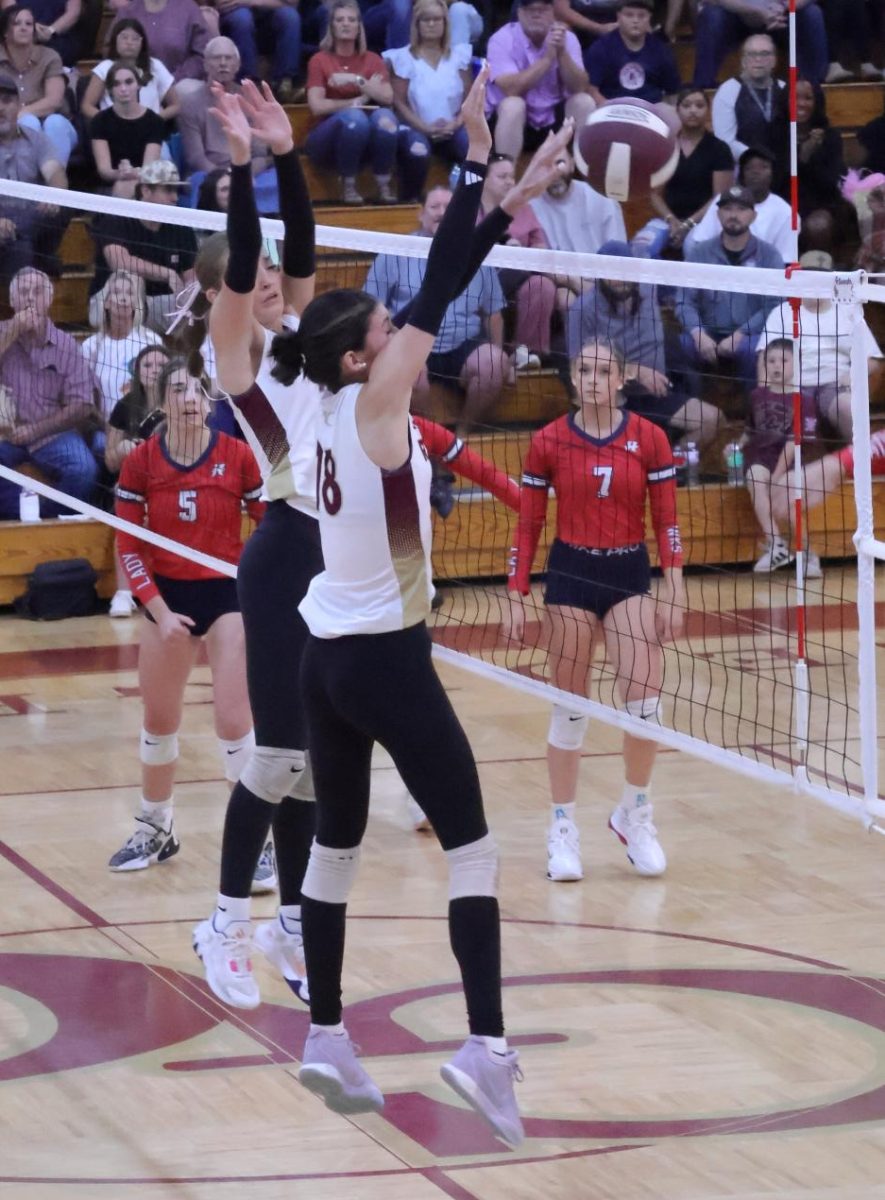 “Put Up the Wall”- Senior Ella Dean blocks Hancock opponent. They grabbed the south state title by defeating Hancock 3-0. The Rebels played Lake Cormorant Oct. 17 in Clinton for the state title.